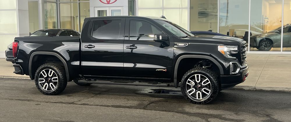 Client's black GMC Sierra AT4 pickup at the dealership